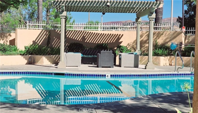 view of swimming pool featuring a pergola and a patio area