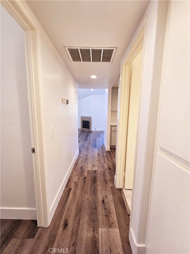 corridor featuring hardwood / wood-style floors