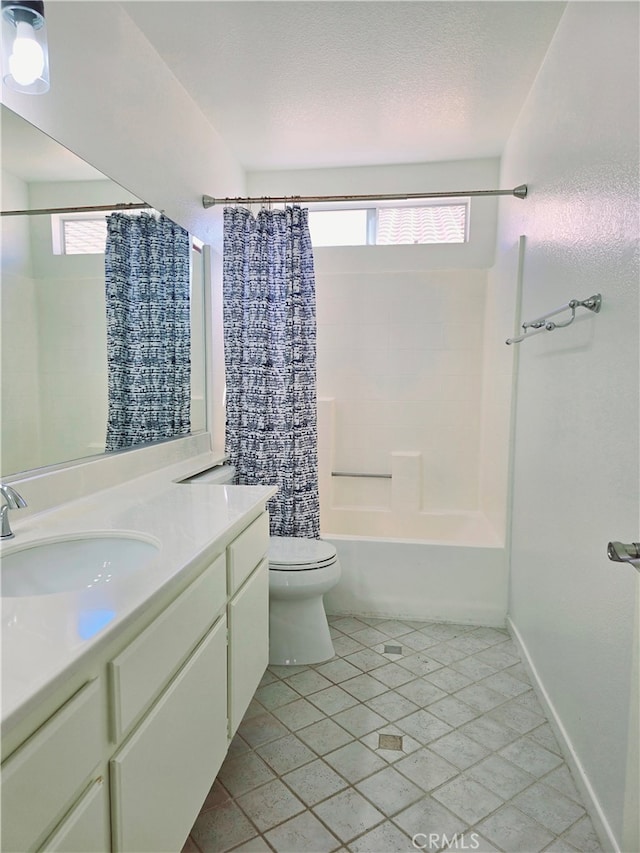 full bathroom featuring vanity, shower / bath combo with shower curtain, toilet, and tile patterned flooring