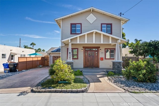 view of front of property featuring a garage and a porch