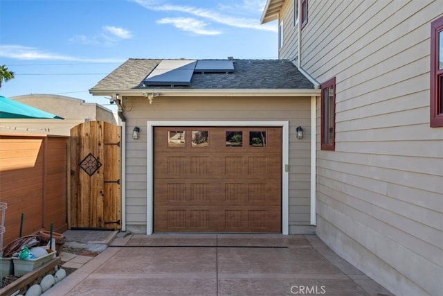 garage featuring solar panels