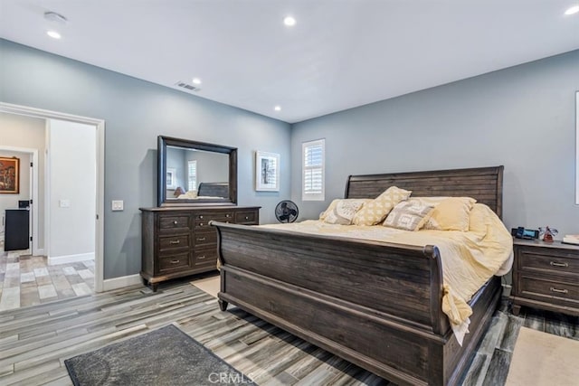 bedroom with light hardwood / wood-style floors