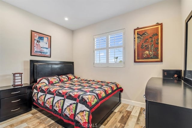 bedroom with light wood-type flooring