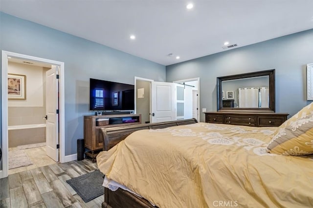 bedroom featuring connected bathroom