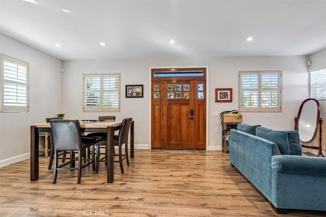 dining area featuring light hardwood / wood-style floors and a healthy amount of sunlight