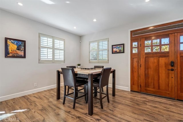 dining space featuring hardwood / wood-style flooring and plenty of natural light