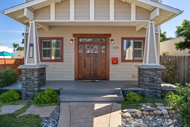 entrance to property with a porch