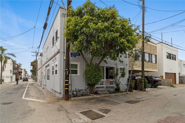 multi unit property featuring a residential view and stucco siding
