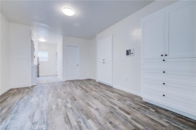 unfurnished room featuring light hardwood / wood-style flooring