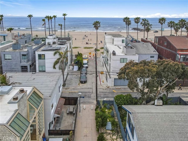 bird's eye view featuring a beach view and a water view
