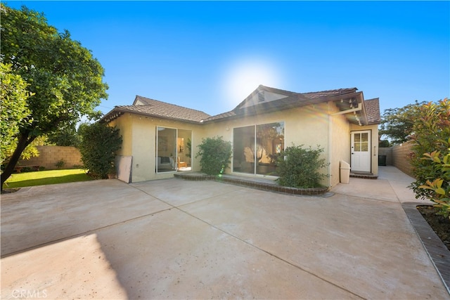 rear view of house featuring a patio area