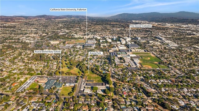 drone / aerial view featuring a mountain view