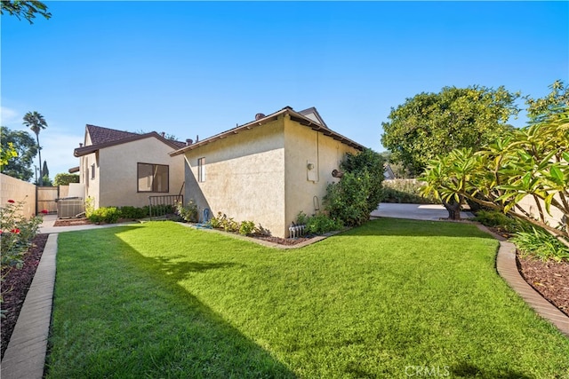 view of home's exterior featuring a lawn