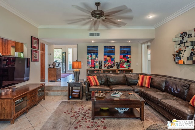 living room with ceiling fan, ornamental molding, and light tile patterned floors