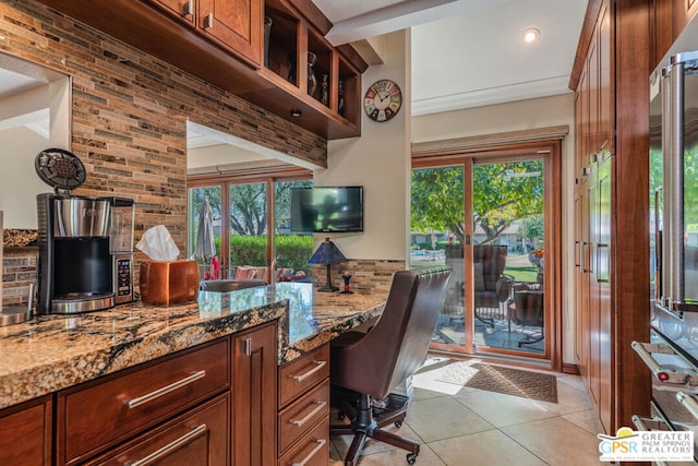 office space with plenty of natural light and light tile patterned flooring