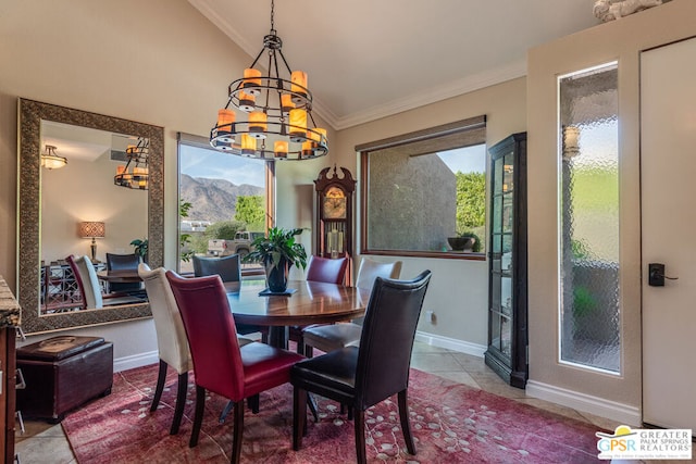 dining area with a mountain view, lofted ceiling, tile patterned floors, crown molding, and a chandelier