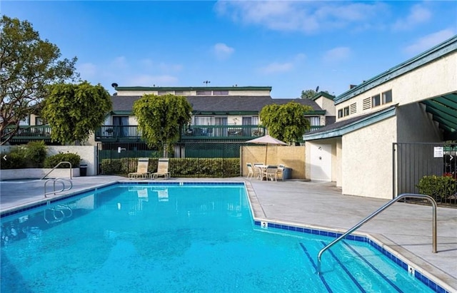 view of swimming pool with a patio