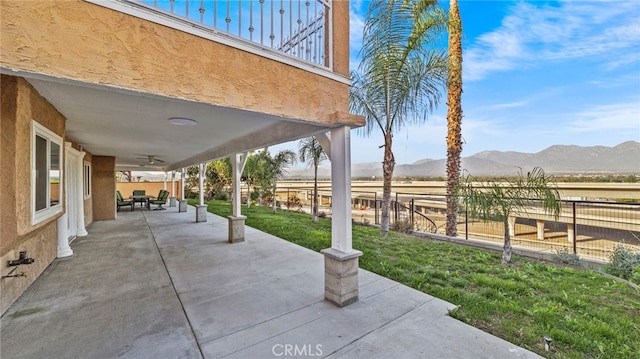 view of patio with a mountain view and a rural view