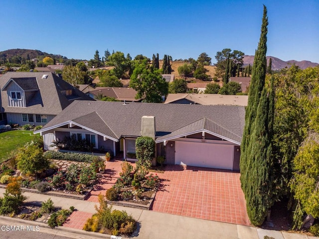 view of front of house featuring a mountain view and a garage