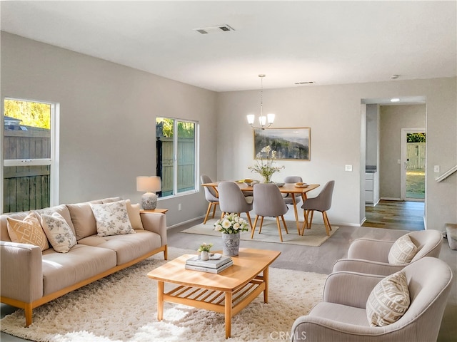 living room featuring a chandelier