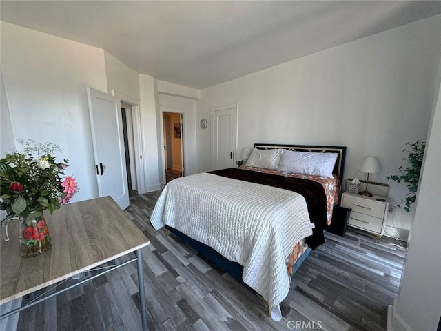 bedroom featuring dark wood-type flooring