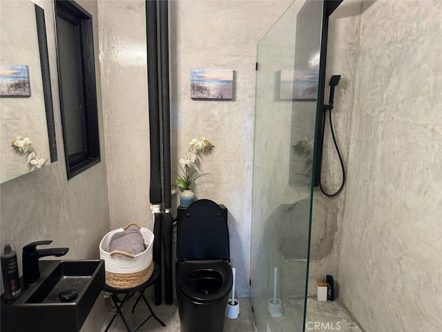 bathroom featuring walk in shower and sink