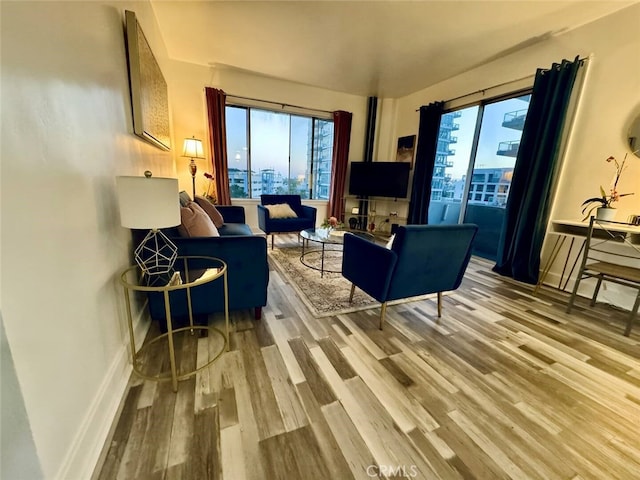 living room with plenty of natural light and light wood-type flooring