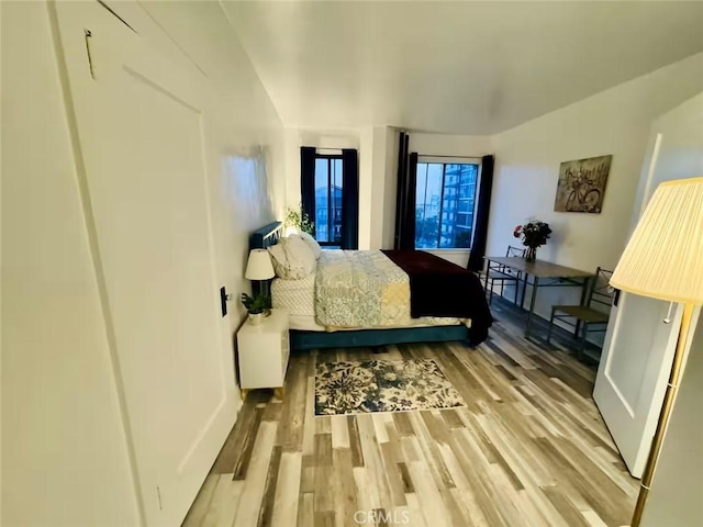 bedroom with light wood-type flooring