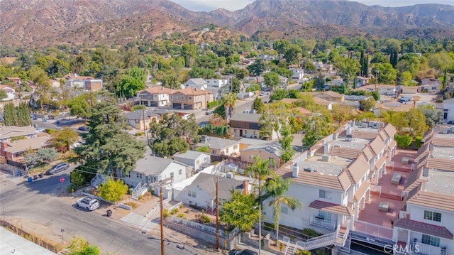 drone / aerial view featuring a mountain view