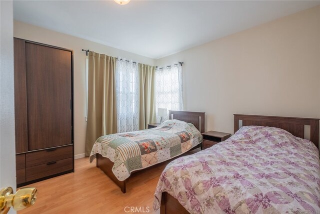 bedroom with light hardwood / wood-style flooring