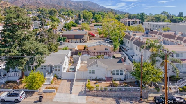 birds eye view of property with a mountain view