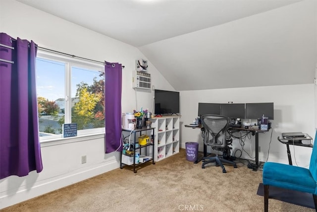 office space with light colored carpet, a healthy amount of sunlight, and lofted ceiling