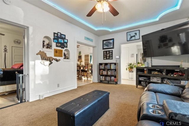 living room with ceiling fan and light carpet