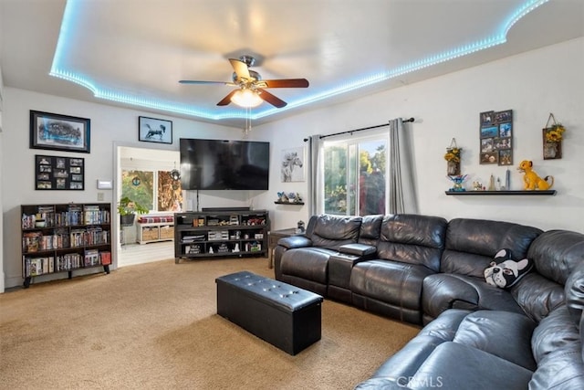 living room with carpet and ceiling fan