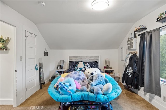 carpeted bedroom with lofted ceiling