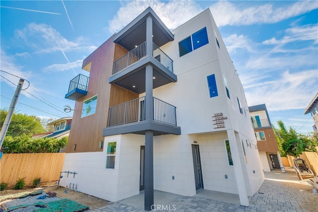 exterior space with a patio and a balcony