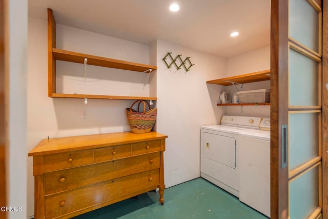 clothes washing area featuring separate washer and dryer