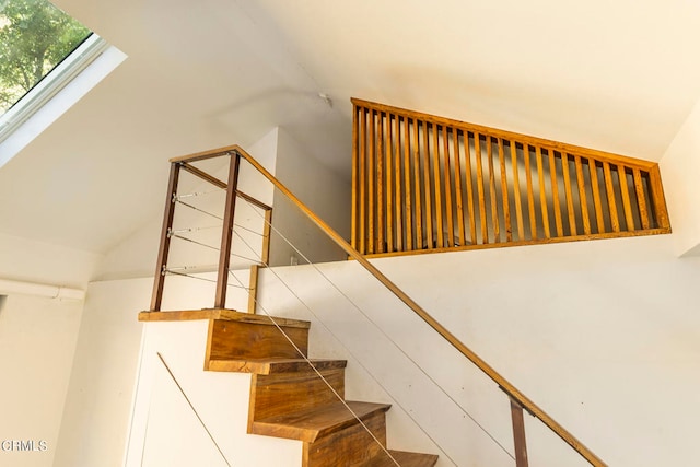 staircase featuring a skylight