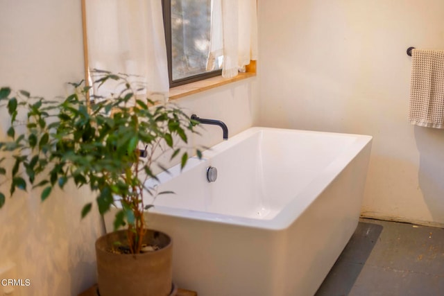 bathroom featuring a tub