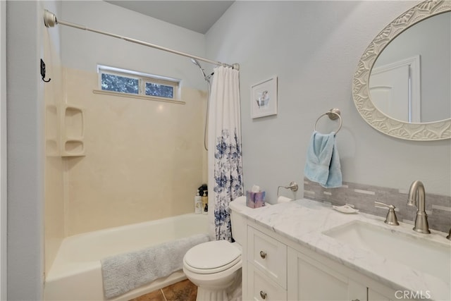 full bathroom featuring vanity, toilet, tile patterned floors, and shower / bath combo with shower curtain