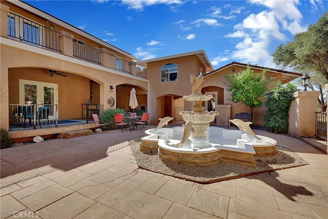 view of patio / terrace featuring french doors and a balcony