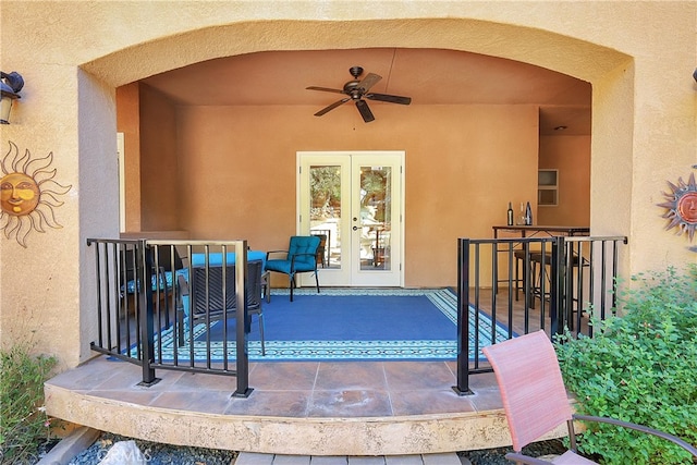 view of patio featuring french doors and ceiling fan