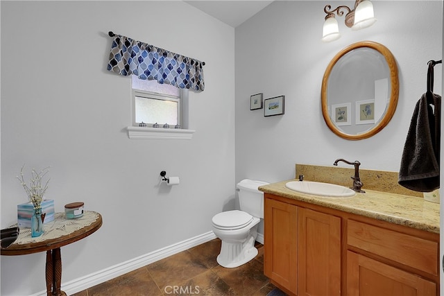 bathroom featuring vanity, toilet, and tile patterned floors