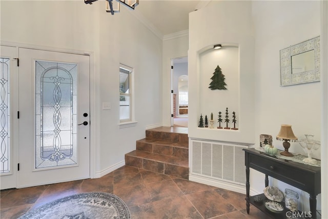 entryway featuring crown molding