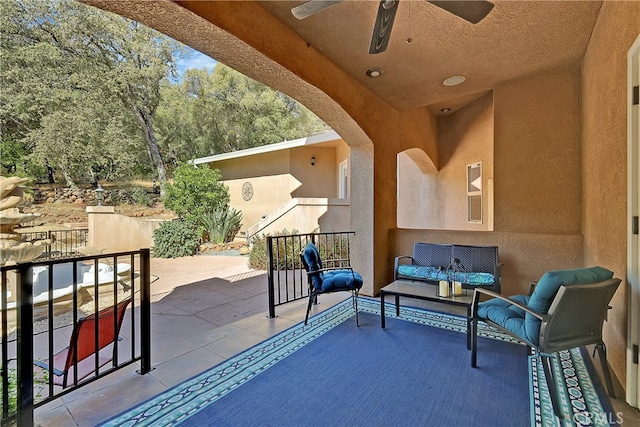 view of patio featuring ceiling fan