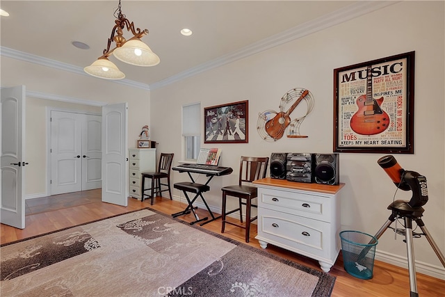 bedroom featuring light hardwood / wood-style flooring and ornamental molding