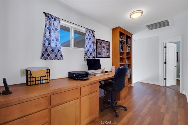 office space with dark hardwood / wood-style floors