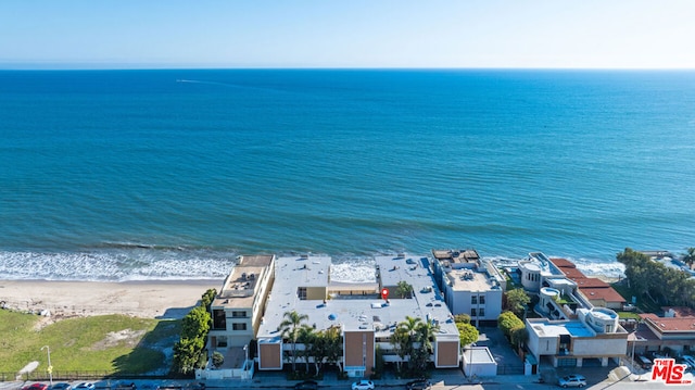 drone / aerial view with a view of the beach and a water view