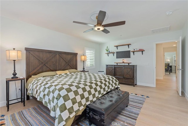 bedroom with light wood-type flooring and ceiling fan