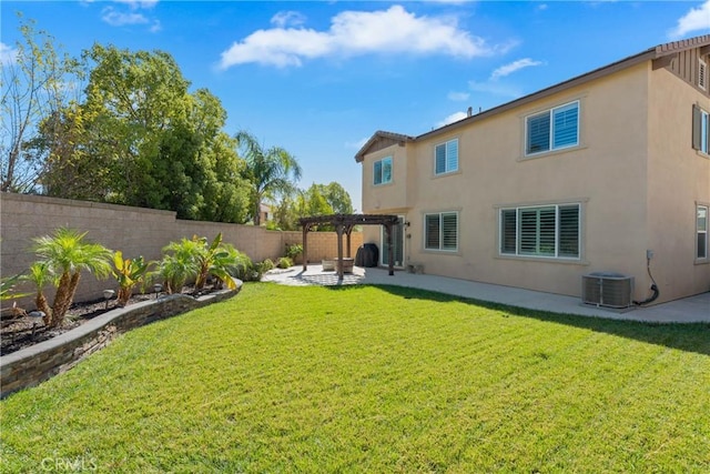 rear view of property featuring a lawn, central AC unit, a pergola, and a patio area